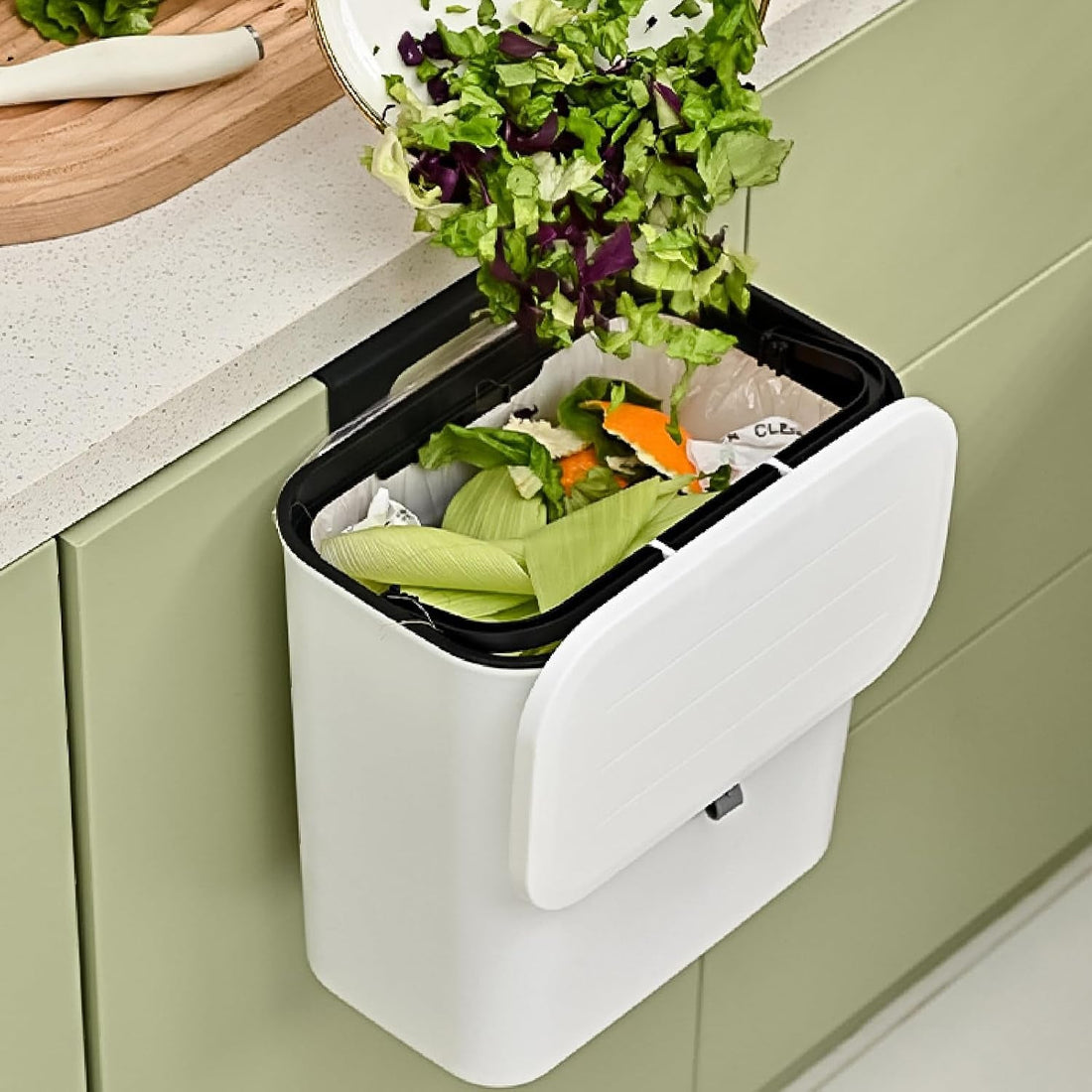 Hanging kitchen dustbin with lid on cabinet door