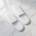 White disposable slippers with cushioned soles