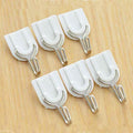 Damage-free self-adhesive hook securely holding multiple towels.