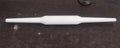 Sturdy plastic rolling pin with anti-skid base for stable operation.