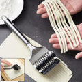 Manual multi-blade dough cutter roller in action cutting dough strips