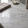 Close-up of transparent bathroom shelf with white hooks