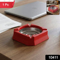 Compact heat-resistant ashtray placed on a modern home office desk