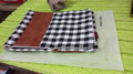 Detailed view of the durable and soft fabric of the leather and cotton pillow cover.