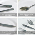 Complete polished stainless steel cutlery laid out on dining table