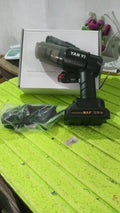 Person using the portable car vacuum cleaner to clean crumbs and debris from car seats.