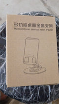 The compact rotating mobile stand displayed from the front, illustrating its minimal footprint on a desk.