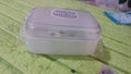 Durable plastic soap dish with a simple pattern, designed for longevity.