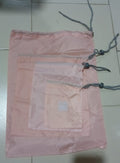 Folding nylon storage pouches for compact packing of various items.