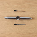 Compact multifunction spinner pen for stress relief and writing