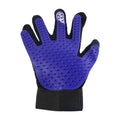 A person using the flexible deshedding glove to comfort and groom their cat.