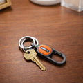 Push lock mechanism on the metal keychain for secure attachment