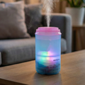 Close-up of the quiet mini humidifier releasing soothing cool mist.