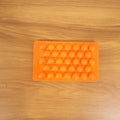 Kitchen candy making mold in orange