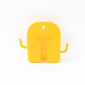 Mobile phone stand with hook holding phone and hanging accessories on wall