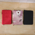 Open makeup organizer bag with cosmetics and brushes inside