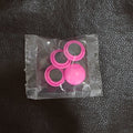 A collection of Round Fridge Magnets in multiple hues, perfect for home and office use.