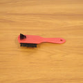 Shoe cleaning brush in use cleaning sneakers to remove dirt and stains