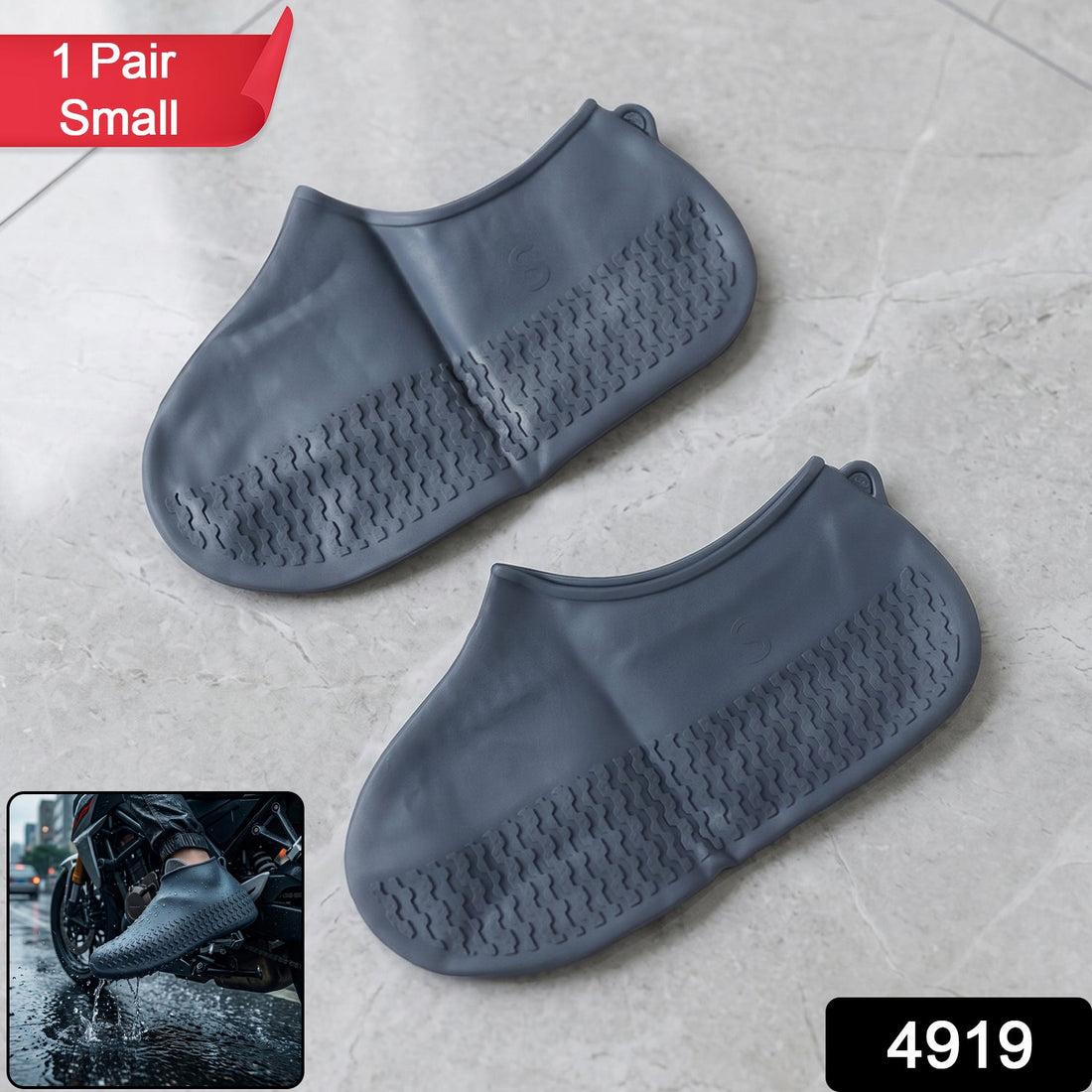 Two gray silicone shoe covers with textured soles lie on a light gray tiled floor, with an inset of a person wearing one on