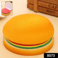 Stack of multicolor burger sticky notes next to a pen, ready for jotting down important memos.