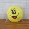 Smiley face plush pillow cushion in a colorful kids’ room setting