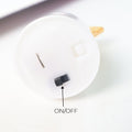 Close-up of LED star-shaped flameless tealight candle
