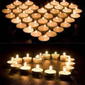 Arrangement of white LED tealight candles, ideal for festive lighting and events.